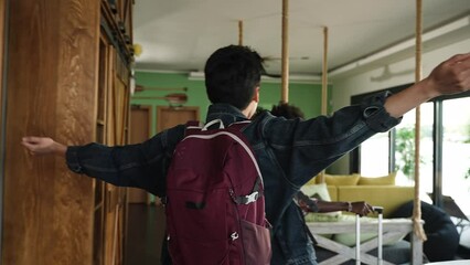 Beautiful diverse young couple entering their vacation apartment - Powered by Adobe