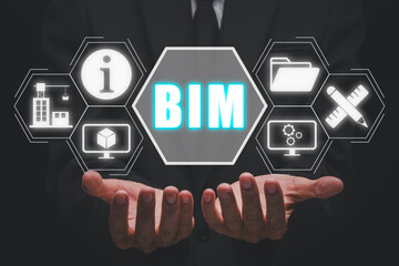 BIM, Building Information Modeling Technology concept, Businesman hand holding Building Information Modeling icon on virtual screen, Industry construction, Architect designer.