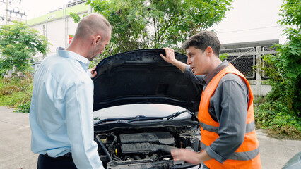 Caucasian male office worker is expressing anger, dissatisfaction, arguing with an identified person. After driving into collision. car was broken down on the road. While waiting for car insurance