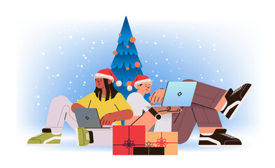 mix race man woman in santa hats near decorated christmas tree using laptops social media communication new year holidays celebration