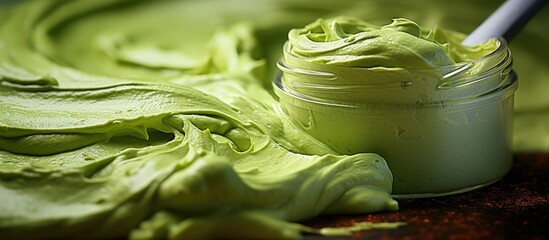 Close up texture of green clay cucumber mask avocado cream green tea wrap Selective focus with brush strokes on abstract background