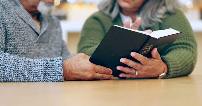 Reading Book, Hands Or Old Couple With Bible In Home For Faith, Religion Or God With Hope In House. Studying Jesus Christ, Worship Or Senior Christian People Learning Literature Or Spiritual Prayer