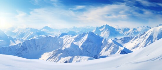 Naklejka premium A view of majestic mountains blanketed in snow that takes your breath away