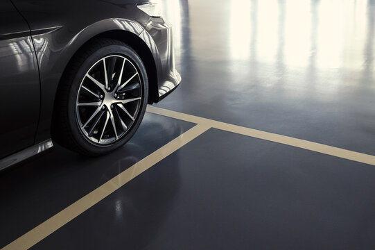 close up of modern car in parking lot, anti slip coating floor for safety