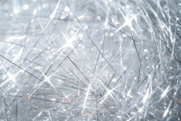 Abstract Christmas background made of tinsel with bokeh.