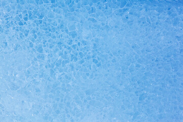 Fototapeta na wymiar Texture of winter ice surface. Blue natural ice background