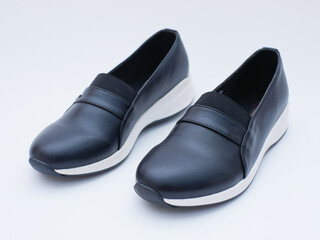 a pair of women's black casual loafers