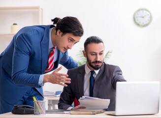 Two male colleagues in the office