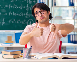 Young male student in the classroom