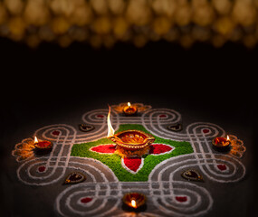 Clay diya lamps lit during diwali celebration, Diwali, or Deepavali, is India's biggest and most...