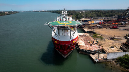 Harbor Freight: a Vessel Approaching the Dock on a river