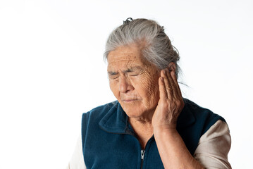 earache. old woman touching her ear because of ear pain. otitis concept. White background.