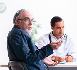 Male doctor in courthouse meeting with lawyer