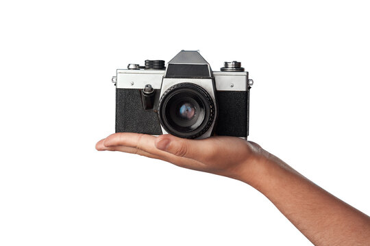 Camera in hand, photography and creative with vintage technology isolated on transparent png background. Person with retro gadget, photographer and picture journalist with lens, blog and hobby
