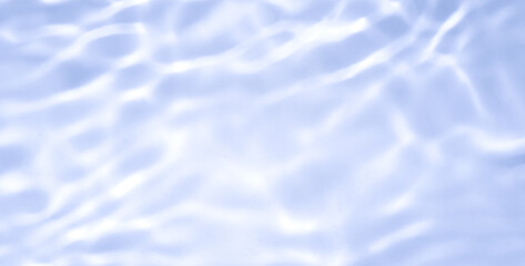 Natural background of water in summer. Blue surface. Clear water with ripples and splashes. water waves in sunlight The water surface has waves.