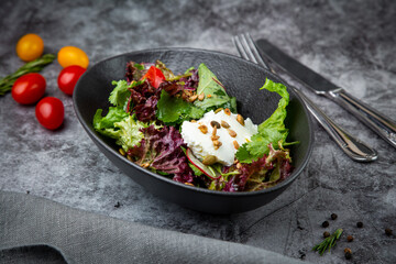 salad with spinach, eel, lime, sour cream, side view