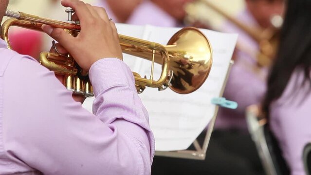 Music band of latino hispanic musicians playing wind instruments, trompet, classic music concert, people of hispanic brown skin