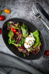 salad with spinach, eel, lime, sour cream, top view