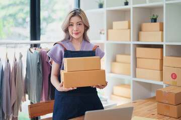 Online delivery, female small business owners are ecstatic when they see unexpected sales and customer orders in their business planning and marketing