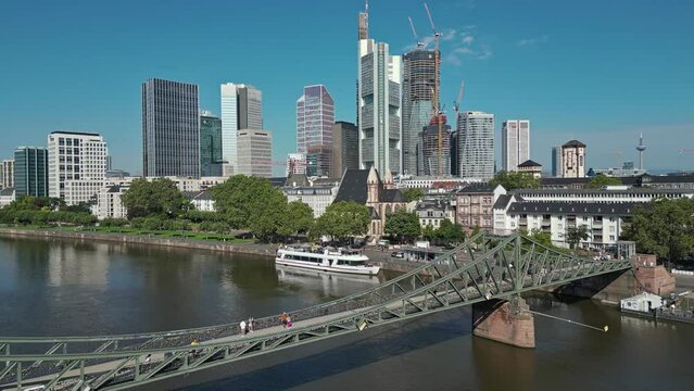 Beautiful aerial footage of Eiserner Steg bridge, Frankfurt, Germany