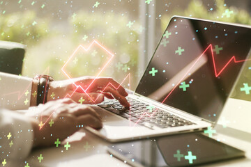 Creative concept of heart pulse illustration and hands typing on laptop on background. Medicine and healthcare concept. Multiexposure - obrazy, fototapety, plakaty