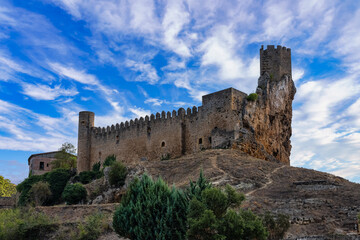 Fototapeta na wymiar Medieval castle that stands on top of a hill next to the old town of Frias, Burgos.