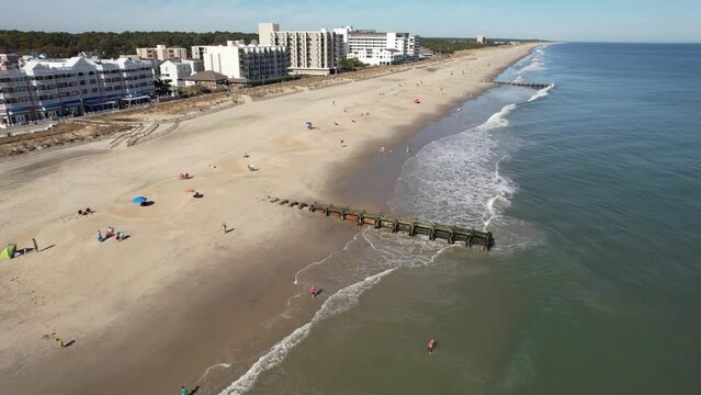 Rehoboth beach delaware drone descending spiral over swimmers in Atlantic Ocean 