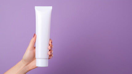 Close up of hand holding tube cosmetics product. Skincare hygiene moisturiser