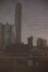 The shadow of the city seen through a perforated gate 4000x6000 
