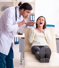 Young male doctor and female beautiful patient