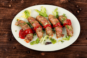 Plate of fried sausages with herbs