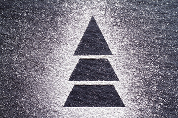Christmas tree made of flour on black background, creative christmas background