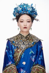 A Asian woman dressed in Qing Dynasty Empress attire