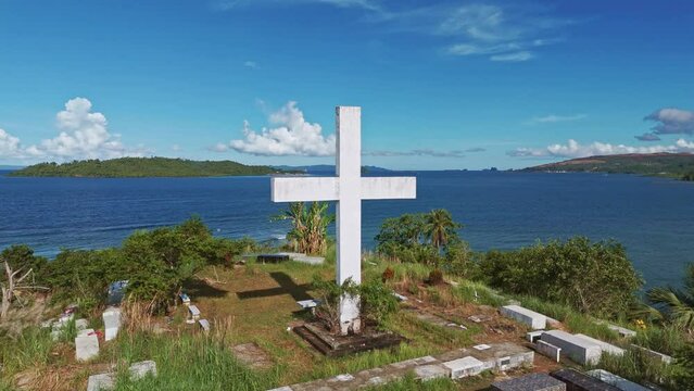 Aerial Shot of Catholic Cemetery Overlooking Bay in Surigao Del Norte, Philippines
