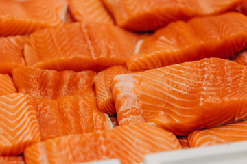 cut and packaged pieces of salmon in a restaurant before cooking