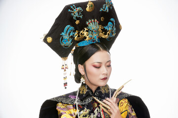 A Asian woman dressed in Qing Dynasty Empress attire