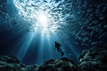 Tuinposter Silhouette of diver and school of fish in the blue sea, AI Generated © Ifti Digital