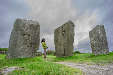woman observing the menhirs, Megalithic Circle of Drombeg, - The Altar of the Druid-, Rosscarbery...