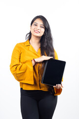 Obraz premium Young Indian, asian business woman, collage girl, student, confident female entrepreneur wearing professional outfit dress pointing at tablet for advertisement isolated on white background