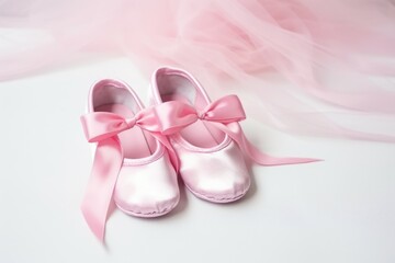 pink satin ballet shoes on a white floor