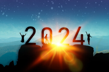 Silhouette two tourist hikers climbing up mountain and jumping on the top of mountain with 2024 numbers. Happy new year and holiday celebration. High quality photo