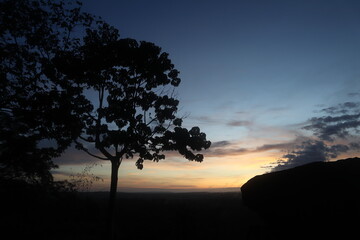 a silhouette of a group of people at sunrise in Bromo