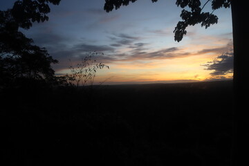 a silhouette of a group of people at sunrise in Bromo