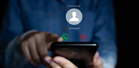 Woman receiving a call on her smartphone from an unknown number, malicious phone calls concept, POV...