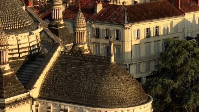 Close-up aerial view of a statue representing a woman or a saint at Saint Front Cathedral in Périgueux, Dordogne.