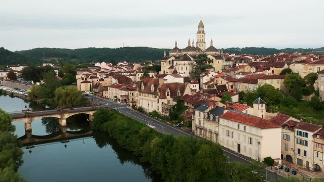 Drone shot along the river Isle, the city of Périgueux with the Roman Catholic cathedral Saint-Front, Dordogne, France