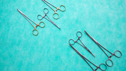 Fototapeta premium Flat lay of stainless forceps medical scissors. Medical instruments. Medical Surgical Instrument. Equipment used in surgery.