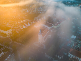 Dalat Cathedral church in the center of the city in misty morning 