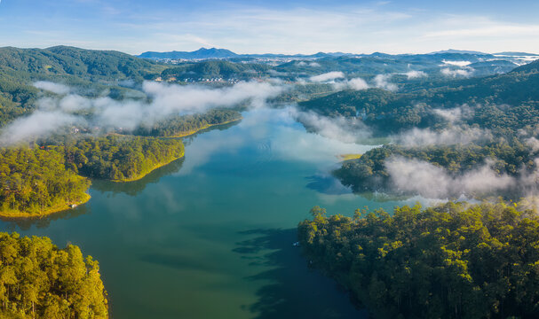 Ariel view of Tuyen Lam lake in Dalat, Vietnam in misty sunny morning 