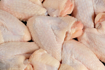 Raw chicken wings close up